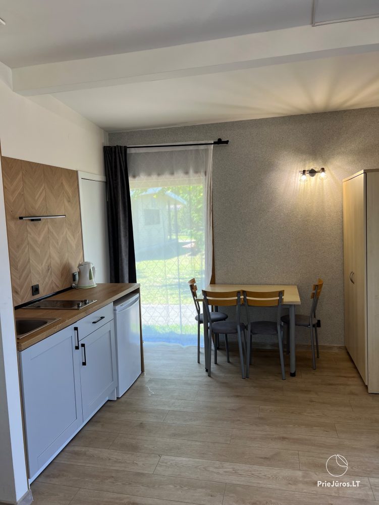 Vilnelė  Kompleks rekreacyjny: domki letniskowe, apartamenty, pokoje do wynajęcia blisko morza