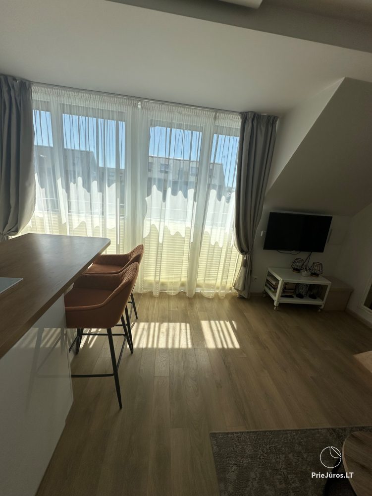 Przytulne apartamenty na twój wypoczynek w Kunigiškės z basenem na zewnątrz