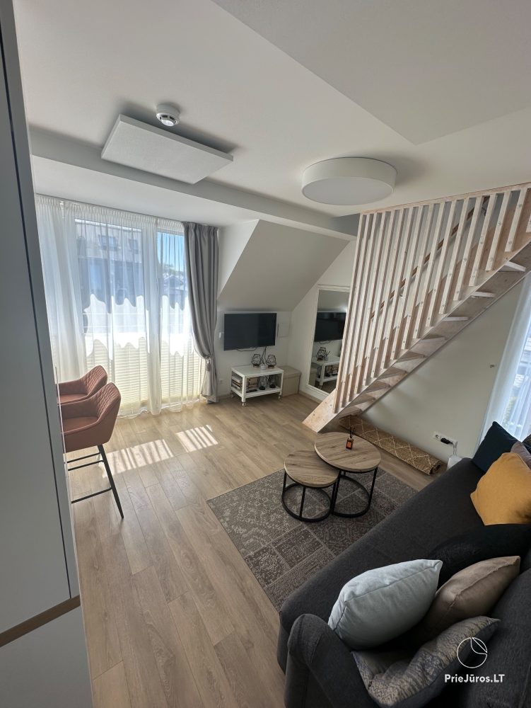 Przytulne apartamenty na twój wypoczynek w Kunigiškės z basenem na zewnątrz