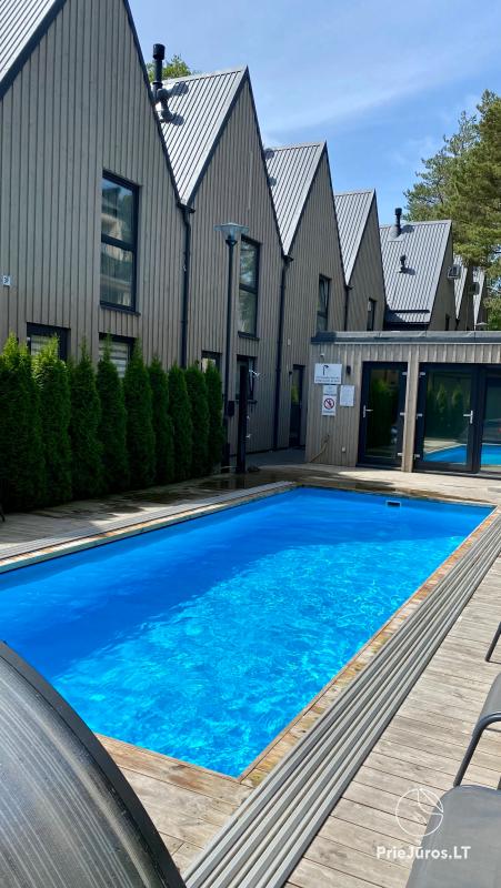 Do wynajęcia apartament z podgrzewanym basenem w kompleksie Ciki Puki, w Kunigiskiai